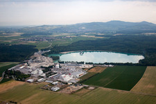 Oblique view of Mixed concrete and building materials factory of Birkenmeier Stein+Design in Gravel mine in the district Niederrimsingen in Breisach am Rhein in the state Baden-Wurttemberg, Germany