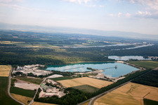 Mixed concrete and building materials factory of Birkenmeier Stein+Design in Gravel mine in the district Niederrimsingen in Breisach am Rhein in the state Baden-Wurttemberg, Germany seen from above