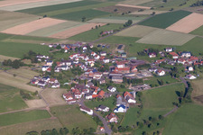 Village - view on the edge of agricultural fields and farmland in Sarrod in the state Hesse, Germany