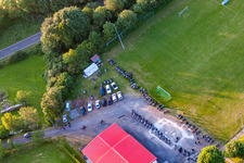 Aerial photograpy of Football field with tent camp in the district Burkhards in Schotten in the state Hesse, Germany