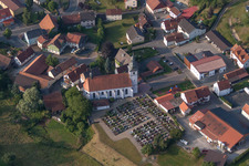 Grave rows on the grounds of the cemetery and church of in Oberleichtersbach in the state Bavaria, Germany
