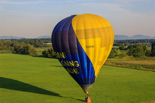 Landing of a hot air balloon D-OTKA in Erlenbach bei Kandel in the state Rhineland-Palatinate, Germany seen from above
