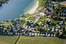Aerial photograpy of Camping with caravans and tents at the lake shore in Roeschwoog in Grand Est, France