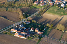 Village - view on the edge of agricultural fields and farmland in Minfeld in the state Rhineland-Palatinate out of the air